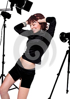 The beautiful girl in a photographic studio