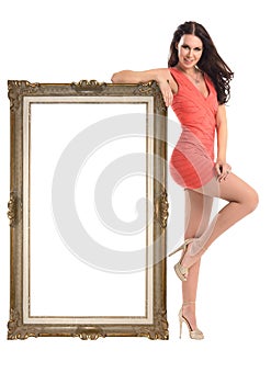Beautiful girl with picture frame isolated on white