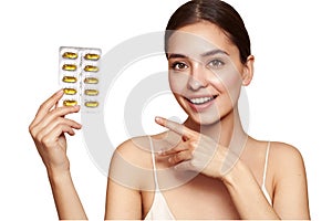 Beautiful Girl With Pill With Cod Liver Oil Omega-3 photo