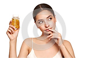 Beautiful Girl With Pill With Cod Liver Oil Omega-3 photo