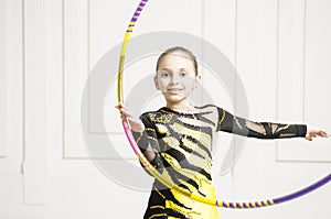 Beautiful girl with Pink Rhythmic gymnastics hoop