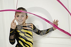 Beautiful girl with Pink Rhythmic gymnastics ribbon