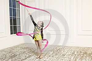 Beautiful girl with Pink Rhythmic gymnastics ribbon