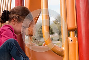 The beautiful girl play on the playground