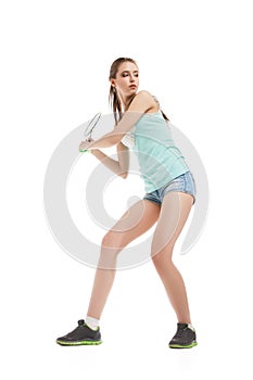 Beautiful girl playing with badminton racket