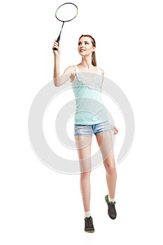 Beautiful girl playing with badminton racket