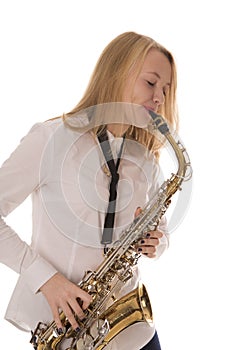 Beautiful girl playing the saxophone