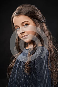 Beautiful girl portrait in studio on black background.