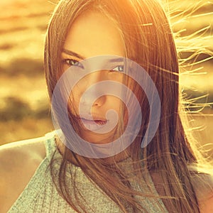 Beautiful girl portrait toned in warm summer colors