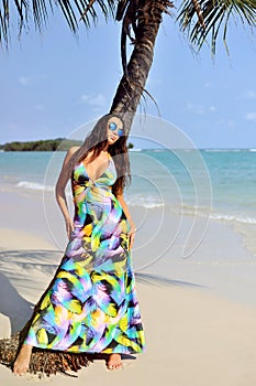 Beautiful girl posing on the beach in hot sun, outdoor portrait