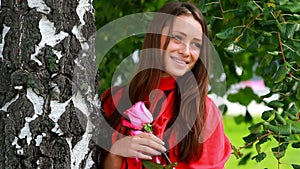 Beautiful girl posing with rose.