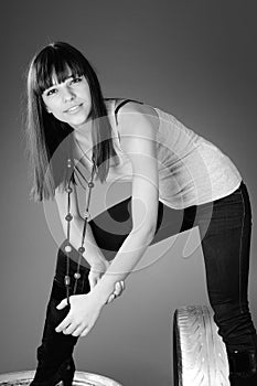 Beautiful girl posing on tyres