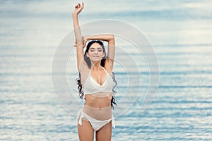 beautiful girl posing in white bikini