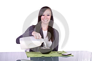 Beautiful Girl Pouring Milk to her Cereal