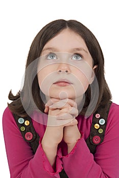 Beautiful girl praying and looking up