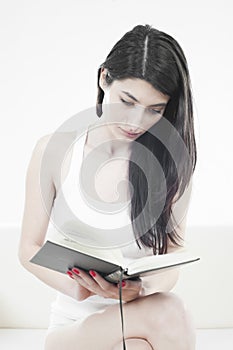Beautiful girl reading a book