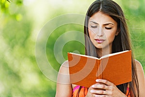 Beautiful girl reading book