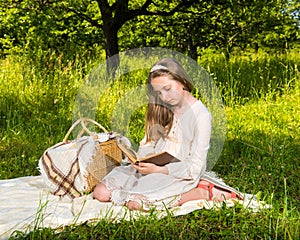 Beautiful girl reading a book