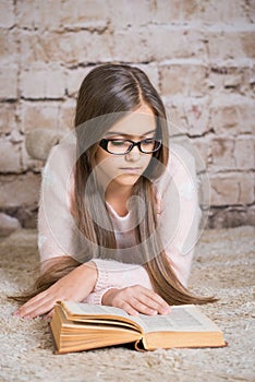 Beautiful girl reading book.