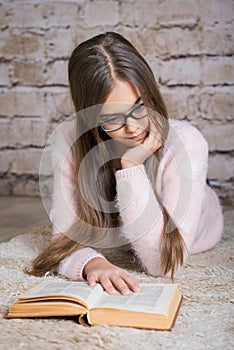 Beautiful girl reading book.