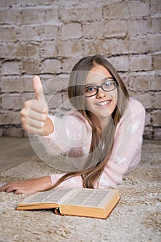 Beautiful girl reading book.