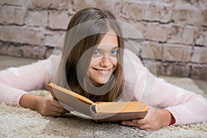 Beautiful girl reading book.