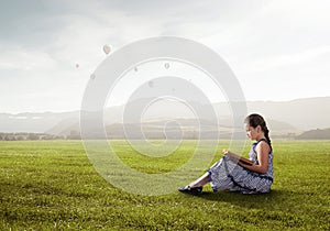 Beautiful girl reading book. Mixed media