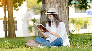 Beautiful Girl reading a book in park.Concept of recreation, education and study , curiosity, leisure time
