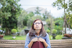 Beautiful girl reading books in the garden