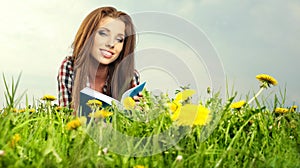 Beautiful girl reads the book