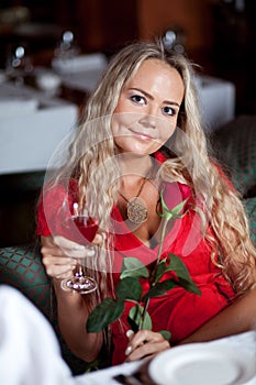 Beautiful girl with red rose