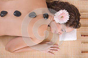 Beautiful girl relaxing on massage table