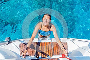 Beautiful Girl relaxing On Yacht in Greece