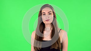 Beautiful girl is reporting and tells a lot of interesting informations. Green screen