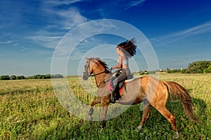 Beautiful girl riding a horse