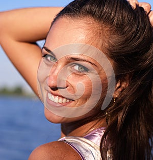 Beautiful girl on the river looking