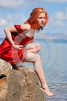 Beautiful girl on the rock