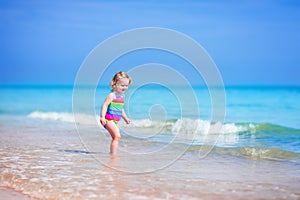 Beautiful girl running on a beach