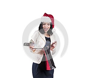 Beautiful girl in santa hat shopping bag isolated money