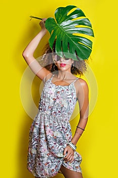 Beautiful Girl selfie with a smartphone. Beautiful young African American woman with afro hairstyle . Summer concept