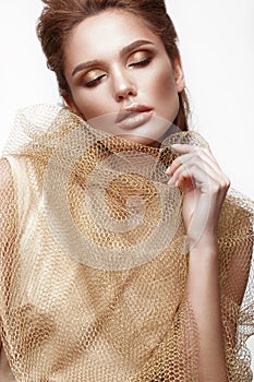 Beautiful girl with sensual lips, fashion hair, gold dress and accessories. Beauty face.