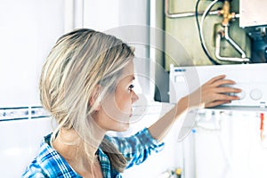 Beautiful Girl Is Seting Up a Boiler