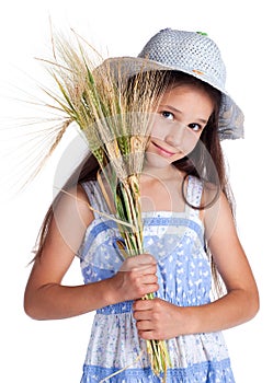 Beautiful girl with sheaf of wheat