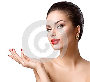 Beautiful girl showing copy space on the open hand