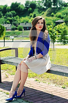 beautiful girl sitting on bench