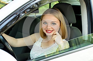 Beautiful girl sitting in the car