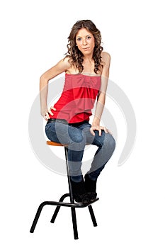 Beautiful girl sitting o a stool