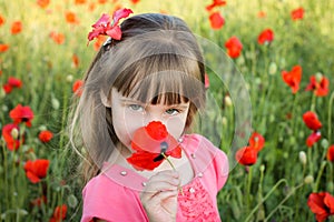 Beautiful girl smells the flower