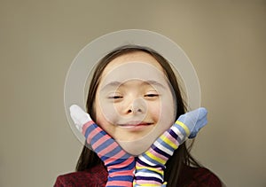 Beautiful girl smiling with different socks