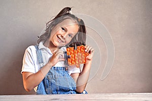 a beautiful girl is smiling holding a pop it hands